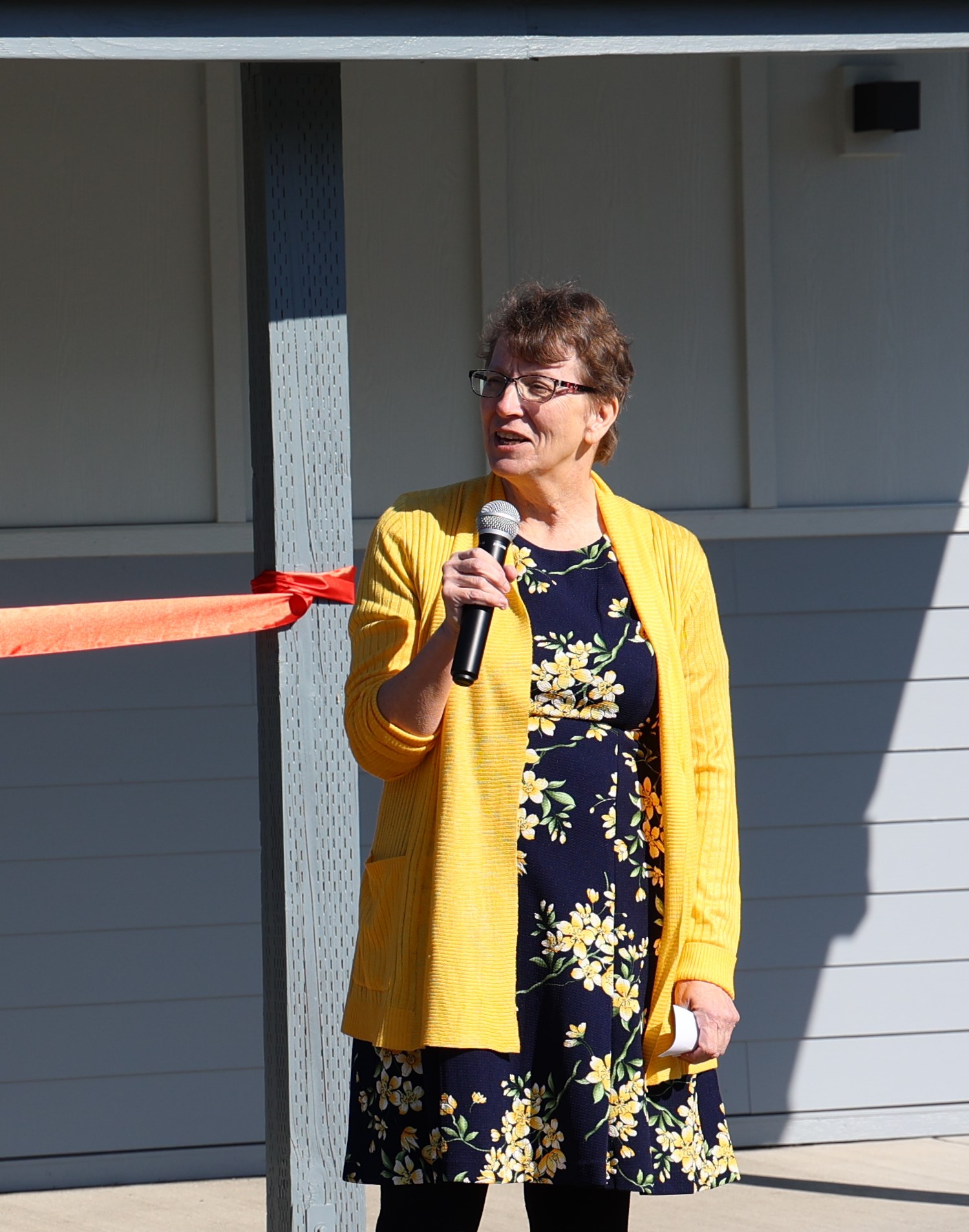 Peggy O'kane speaking at lgrand opening of Maggie Osgood Library